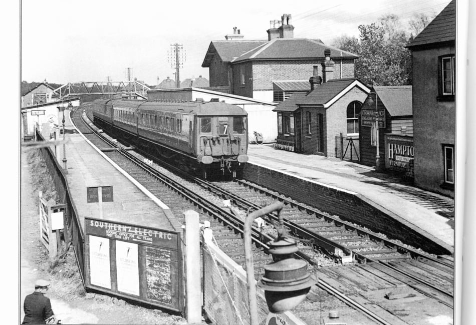<p>This 1937 photograph of Liss Station is captioned: 'General view of Liss, with a Down EMU for Portsmouth at platform'</p>