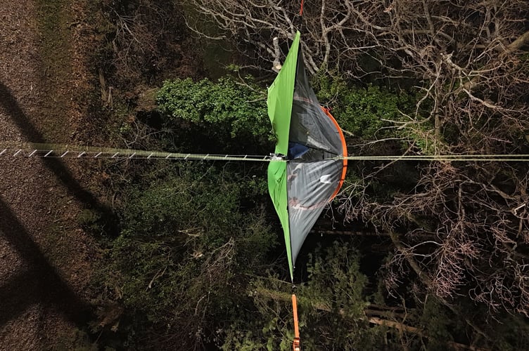 Andrew in his tent suspended high above the ground.