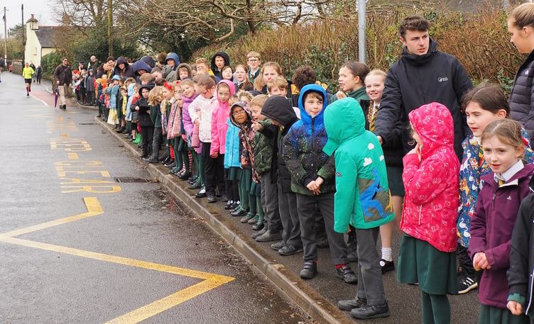 Spectators lined the streets just outside the school ahead of the start
