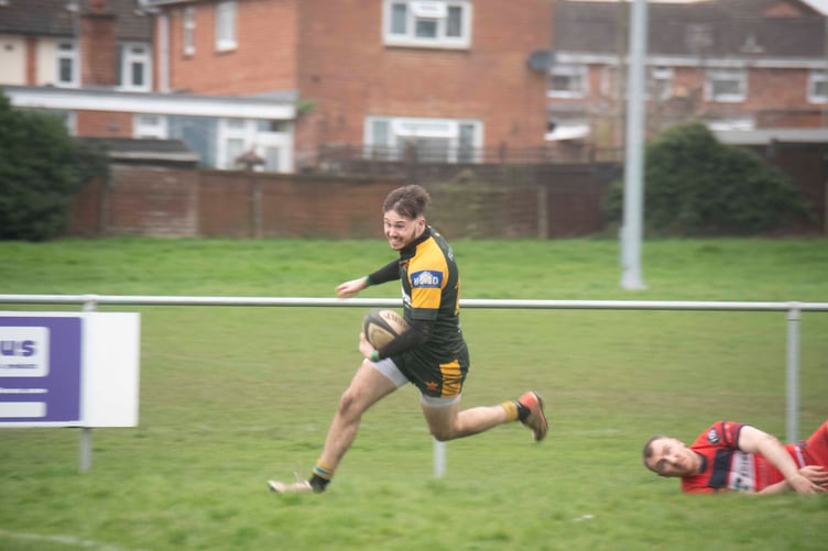Full-back Jacob Ivell sprints for the line
