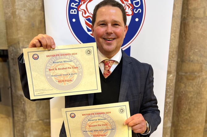 Christian Barrington proudly holds the two British Pie Awards certificates