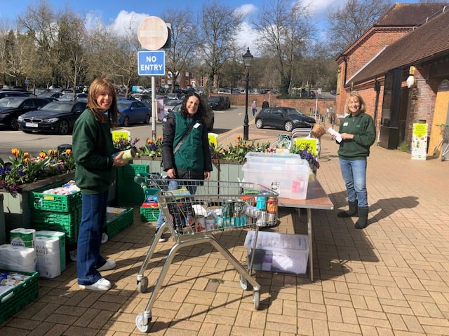 Farnham Foodbank volunteers collecting donations outside Waitrose in Lion & Lamb Yard
