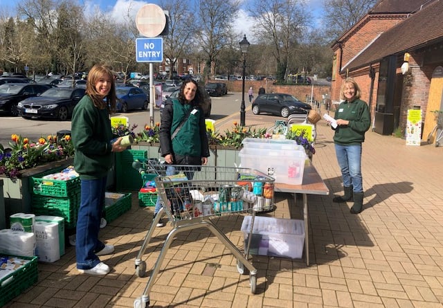 Farnham Foodbank volunteers collecting donations outside Waitrose in Lion & Lamb Yard