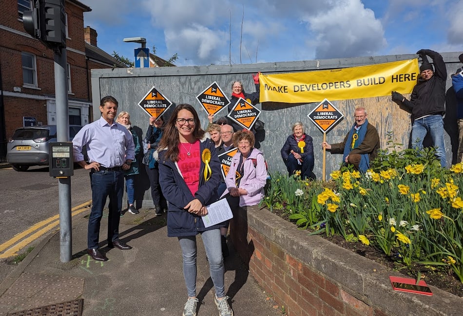 <p>Lib Dem activists protested against the lack of development at the barren Woolmead site in central Farnham on Saturday</p>