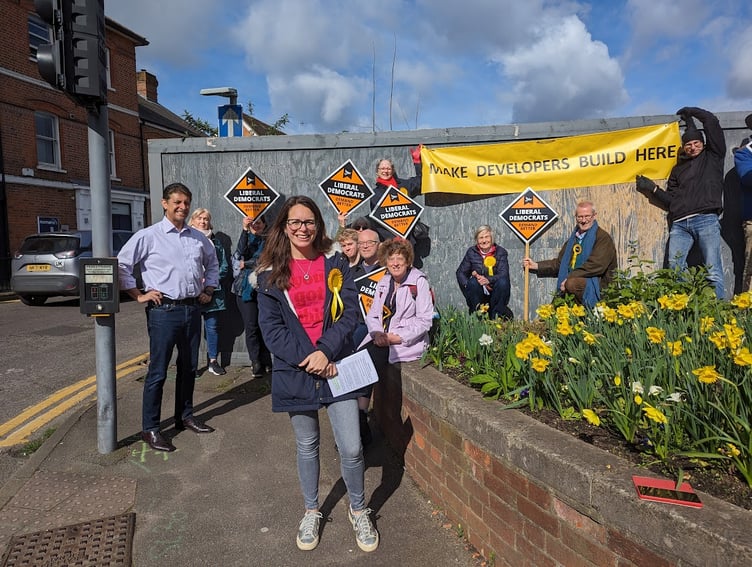 Lib Dem activists protested against the lack of development at the barren Woolmead site in central Farnham on Saturday