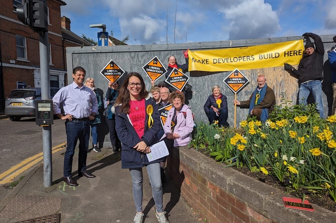 Lib Dem activists protested against the lack of development at the barren Woolmead site in central Farnham on Saturday