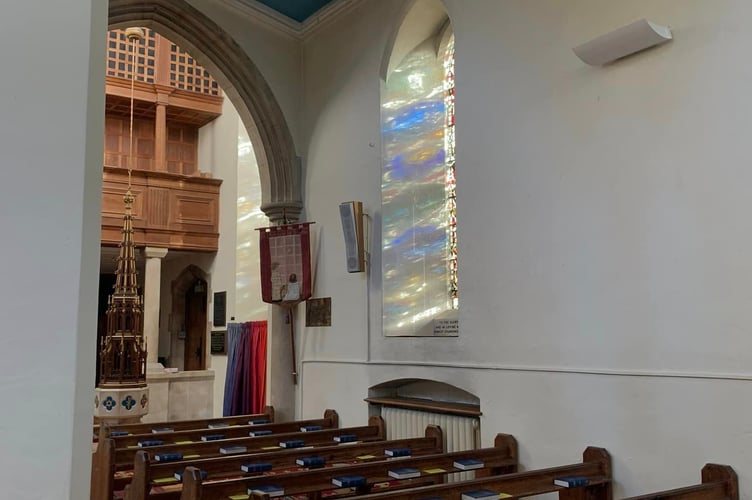 View of more stained glass windows and their colour reflecting at St Thomas Church.