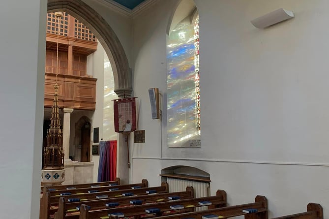 View of more stained glass windows and their colour reflecting at St Thomas Church.