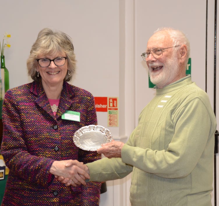 Clive Raisey presents Lucy Croxton with the Clifton Trophy at Bicknoller Spring Flower Show.