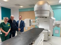 <p>Michael Robson, who is the first patient to have the prostate cancer treatment being trialled at the Royal Surrey, centre, with radiographer Kate Maltby and Dr Philip Turner, Consultant Clinical Oncologist </p>
