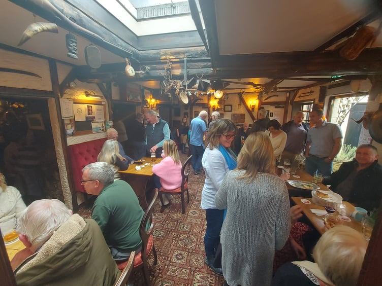 Locals and pub goers gathering to show their support for the Hole in the Wall