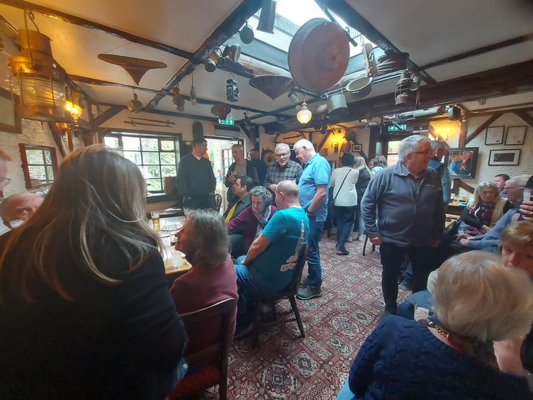 Locals and pub goers gathering to show their support for the Hole in the Wall