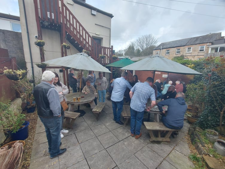 Locals and pub goers gathering to show their support for the Hole in the Wall