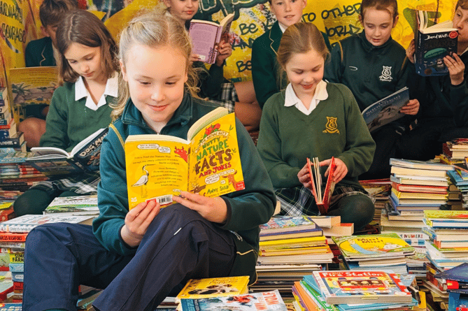 Edgeborough School pupils couldn't help reading a few of their favourites again before sending them off to the Children's Book Project