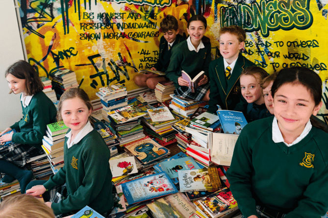 Edgeborough School pupils with their incredible haul of books for the Children's Book Project