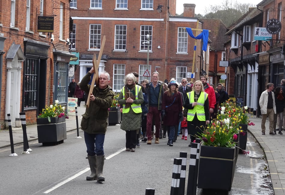 <p>Farnham's Good Friday Walk of Witness procession weaves its way up Downing Street</p>