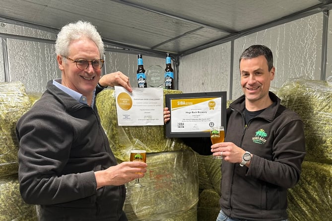 Hogs Back Brewery managing director Rupert Thompson (left) and head brewer Miles Chesterman toast the success of Little Swine 0.5 per cent pale ale