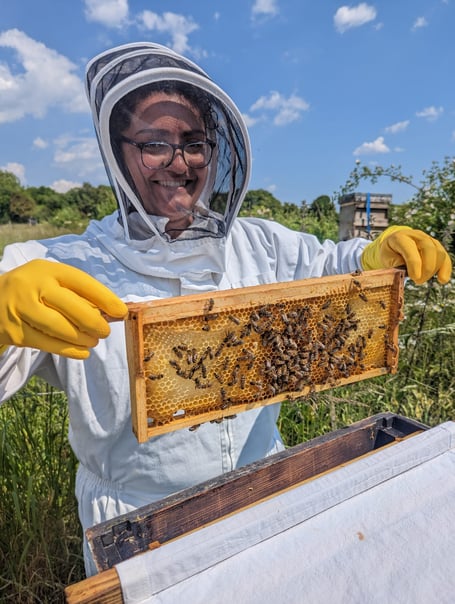 Bex with her hands full at a World of Bees workshop (Photo: Hive Helpers)