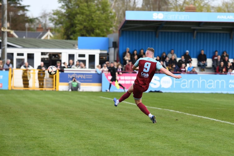Charlie Postance smashes home Farnham Town's second goal against Sheerwater