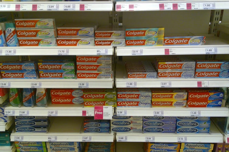 Aisles of Colgate toothpaste – at the back of the supermarket