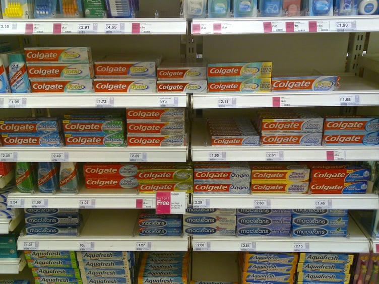 Aisles of Colgate toothpaste – at the back of the supermarket