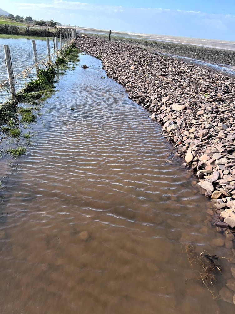 The sea breached a shingle ridge near Dunster.
