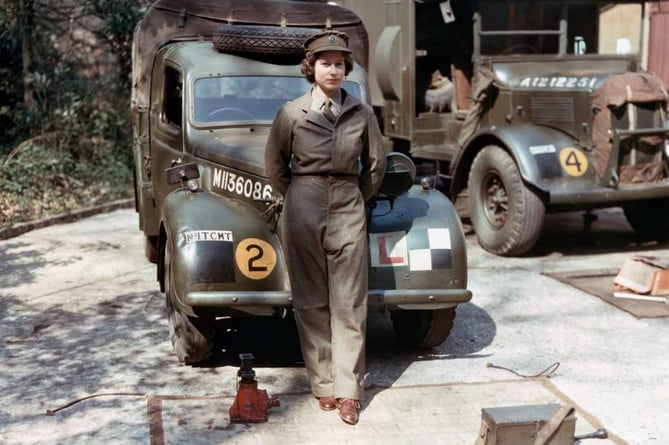 The then-Princess Elizabeth standing in front of an L-plated truck during her time with the ATS