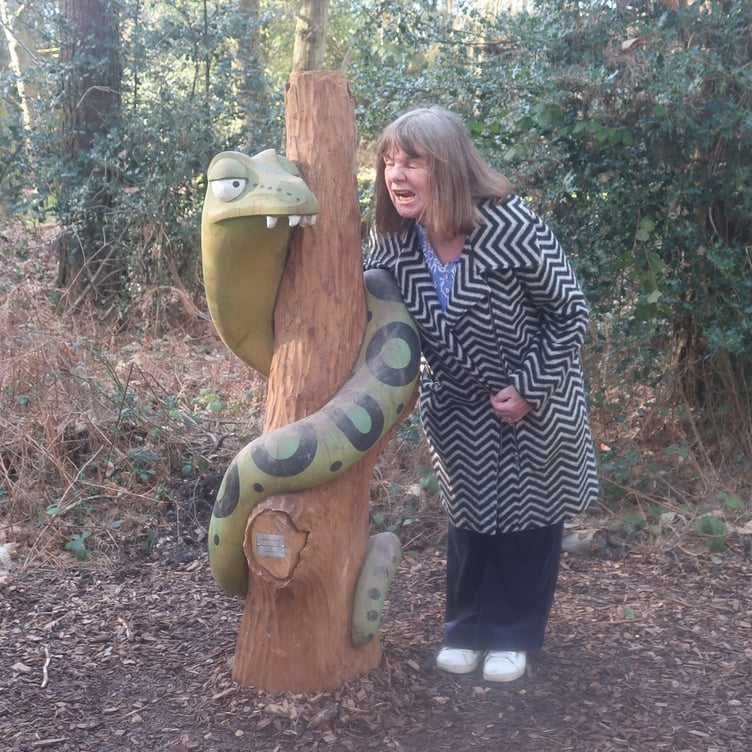 Julia Donaldson, author of The Gruffalo, gets acquainted with Snake – one of four new Gruffalo sculptures unveiled in Alice Holt Forest