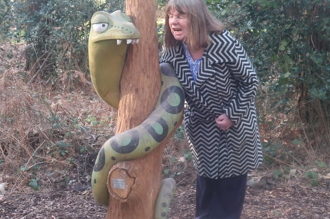 Julia Donaldson, author of The Gruffalo, gets acquainted with Snake – one of four new Gruffalo sculptures unveiled in Alice Holt Forest