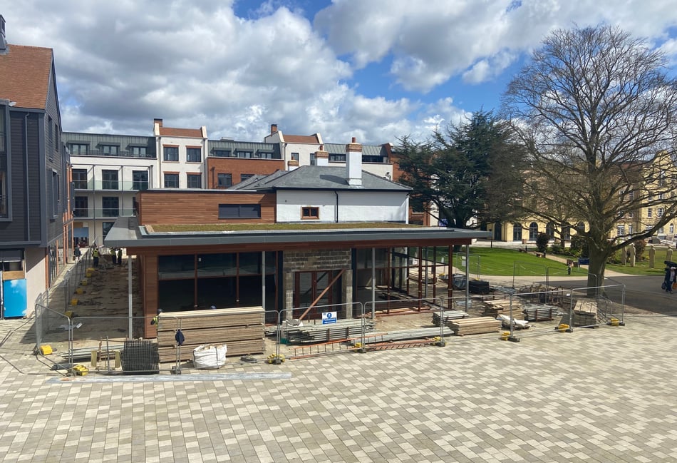 <p>The scaffolding was removed from the Grade II-listed Brightwell House at the heart of the Brightwells Yard development in Farnham this week – revealing the building's new roof and extension. Once complete, it will accommodate a Coppa Club restaurant.</p>