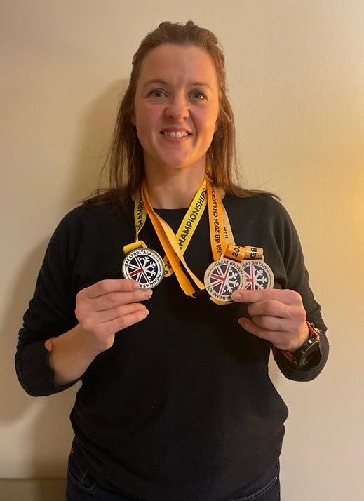 Sam with her championship medals