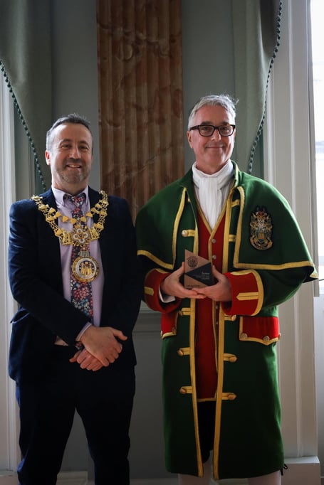 Farnham Town Crier Michael Stephens collects his awards from the Mayor of Warwick Cllr Oliver Jaques.