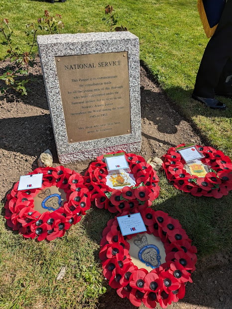 The National Service Memorial in Truro's Victoria Gardens, with wreaths