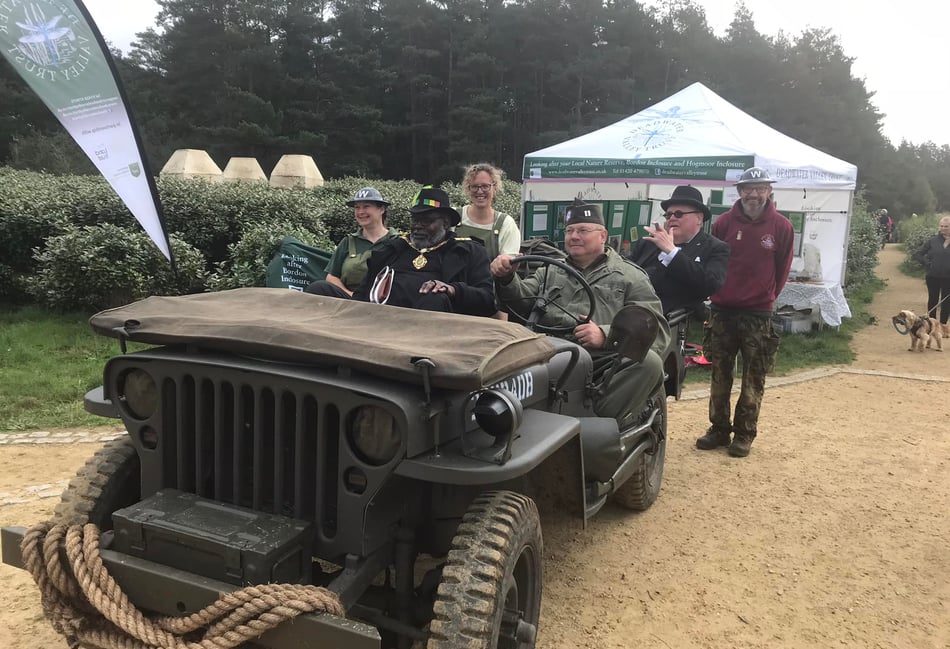 <p>Whitehill town mayor, Cllr Leeroy May, is taken for a ride with Winston Churchill at last year's military event</p>