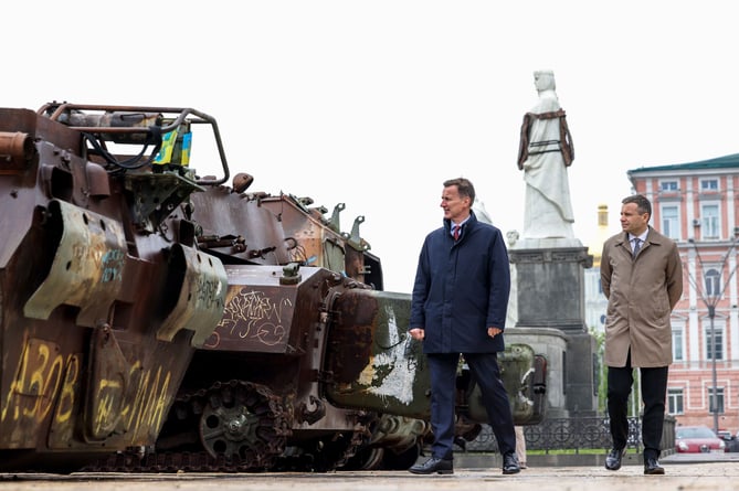 Jeremy Hunt is pictured alongside Ukrainian Finance Minister Serhiy Marchenko in Saint Michael's Square in Kyiv looking at captured Russian tanks.