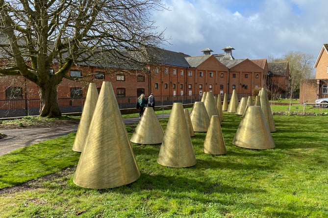 Detractors have likened them to 'dystopian traffic cones', but others love Farnham's A Hand's Turn sculpture on Riverside