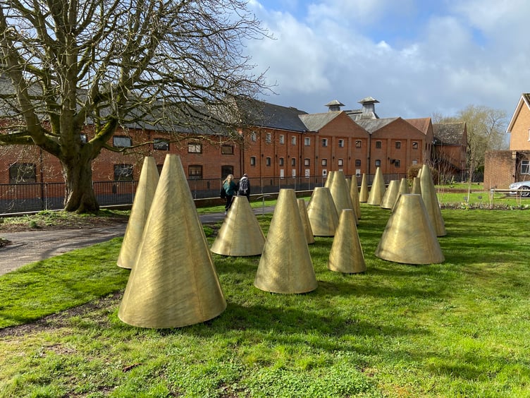 Detractors have likened them to 'dystopian traffic cones', but others love Farnham's A Hand's Turn sculpture on Riverside