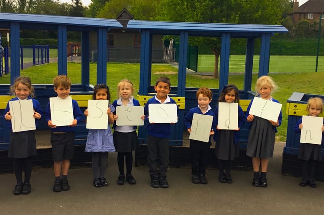 Pupils at Highfield South Farnham celebrate their school's latest 'outstanding' Ofsted rating