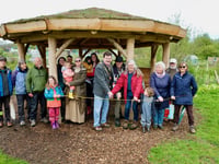 Blooming wonderful as mayor opens eco-shelter at community garden