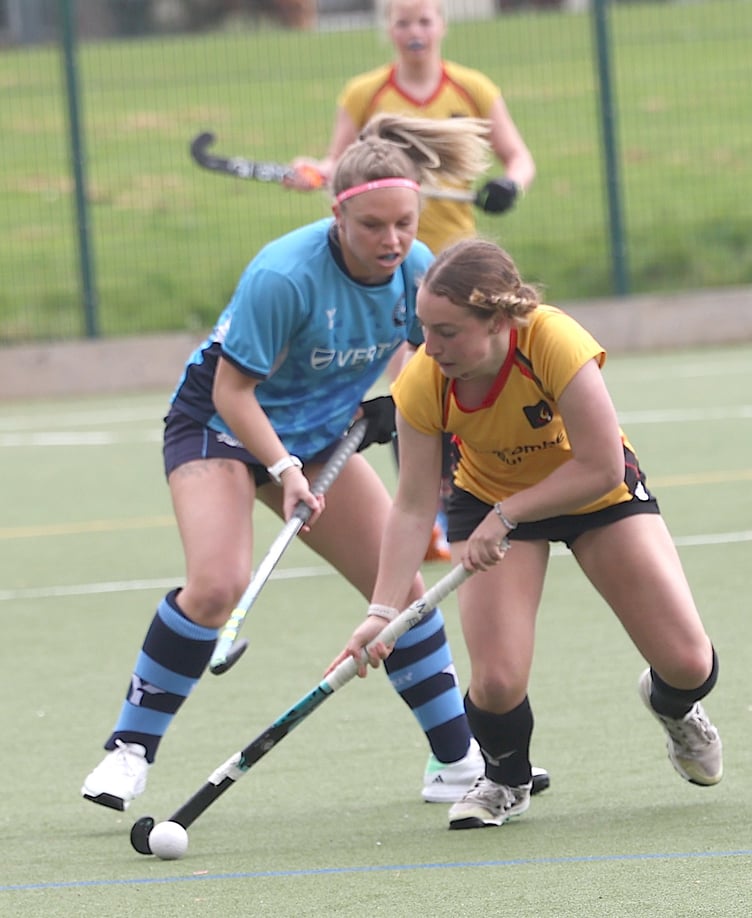 Caradon's Daisy Heal looks to keep possession under pressure.