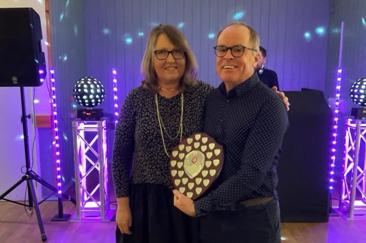 Justin Clarke receives the chairman's award from Nicola O'Connor