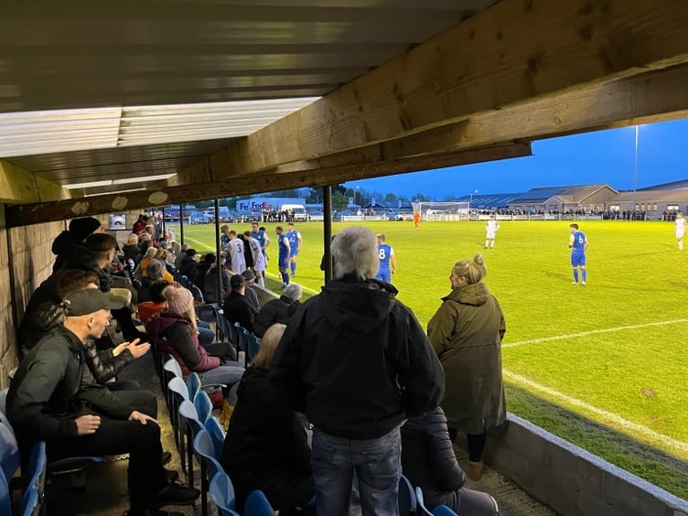 Both sets of players look to see what's going on.
