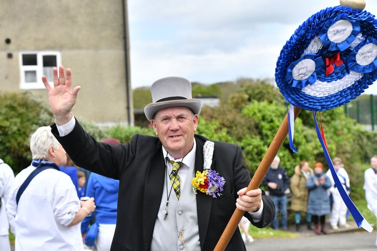 Master of ceremonies Doug David Martyn leads the Blue Oss supporters through the town. (Picture: Adrian Jasper)