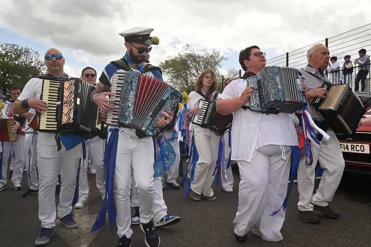 The accordion strike up the good old familiar May Day song. (Picture: Adrian Jasper)