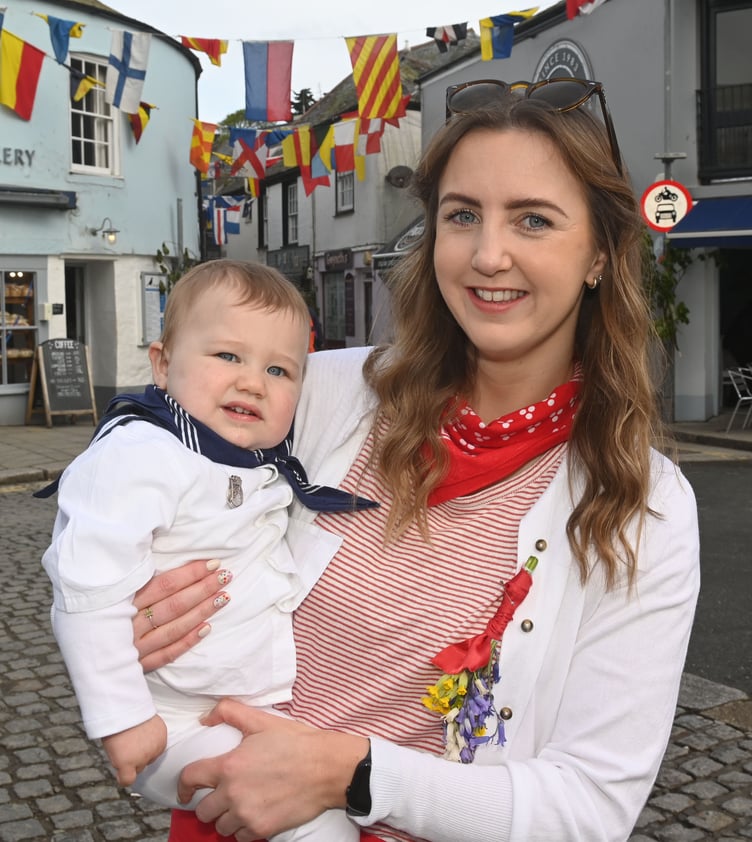 Red and Blue Oss supporters Danielle along with Chester aged one. (Picture: Adrian Jasper)
