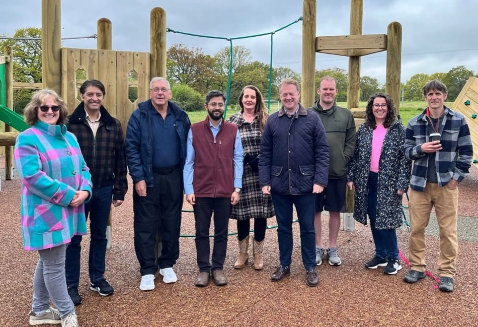 <p>Cllr Adeel Shah (red jacket) cut the ribbon to open Greatham's amazing new play area. He is seen here with some of the parish councillors and working group members which made the project possible.</p>