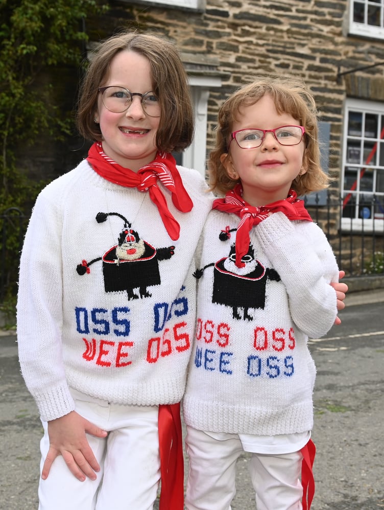 Proud of their matching jumpers are Madeline and Kyra. (Picture: Adrian Jasper)