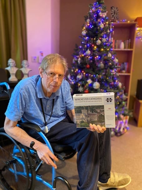 David Matthews with one of his Winchester Cathedral jigsaw puzzles, Waverley Grange, Farnham, May 2024.