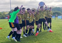 School football team shows resilience to come from behind to win cup