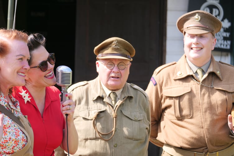 Stephanie Belle singing with some of the re-enactors